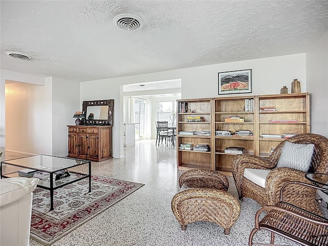 2108 Lee Ln, Sarasota, FL 34231 - living room with speckled floor and a textured ceiling