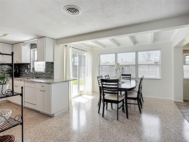 2108 Lee Ln, Sarasota, FL 34231 - dining room with a textured ceiling, beam ceiling, baseboards, and dark speckled floor
