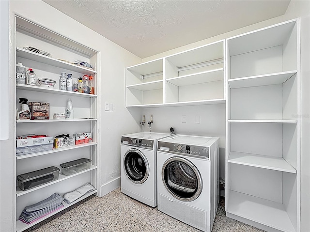 2108 Lee Ln, Sarasota, FL 34231 - laundry room featuring washer and clothes dryer and a textured ceiling