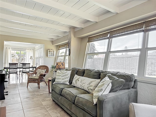 2108 Lee Ln, Sarasota, FL 34231 - living room with healthy amount of natural light, beamed ceiling, and light tile patterned flooring