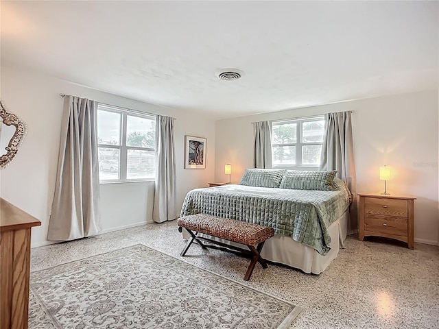 2108 Lee Ln, Sarasota, FL 34231 - bedroom with dark speckled floor and baseboards
