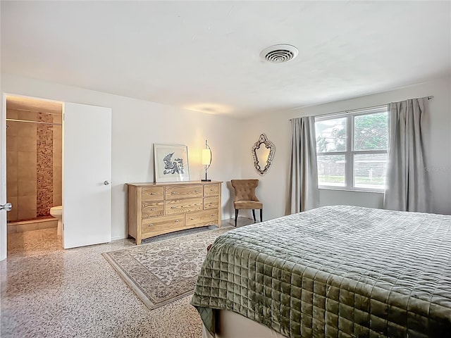 2108 Lee Ln, Sarasota, FL 34231 - bedroom with speckled floor, baseboards, and connected bathroom