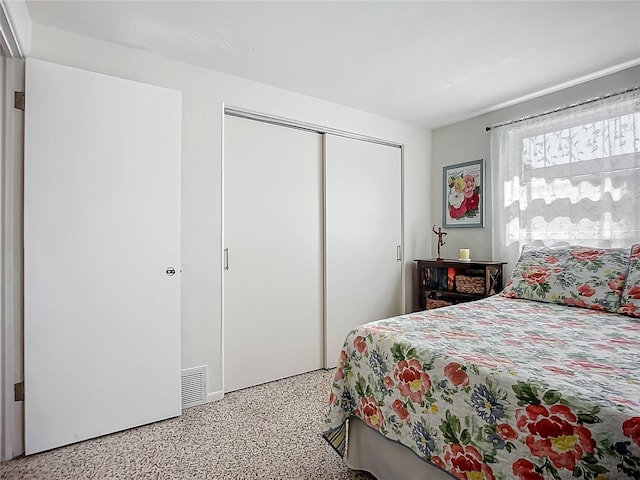 2108 Lee Ln, Sarasota, FL 34231 - bedroom featuring speckle patterned floor and a closet