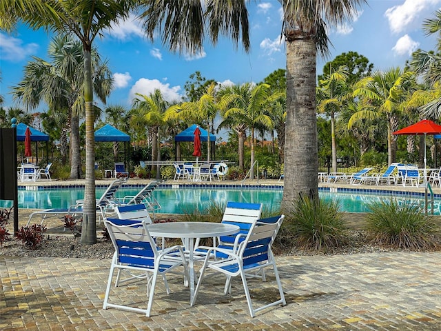 220 Sarezzo Cir, Nokomis, FL 34275 - community pool featuring a patio area