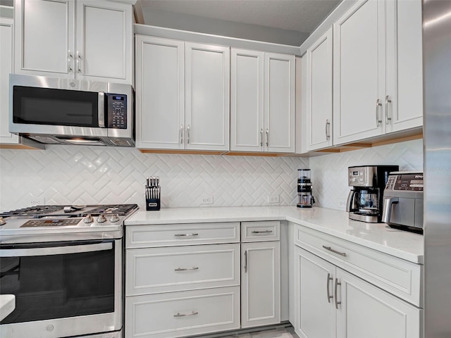 220 Sarezzo Cir, Nokomis, FL 34275 - kitchen featuring appliances with stainless steel finishes, light countertops, and backsplash