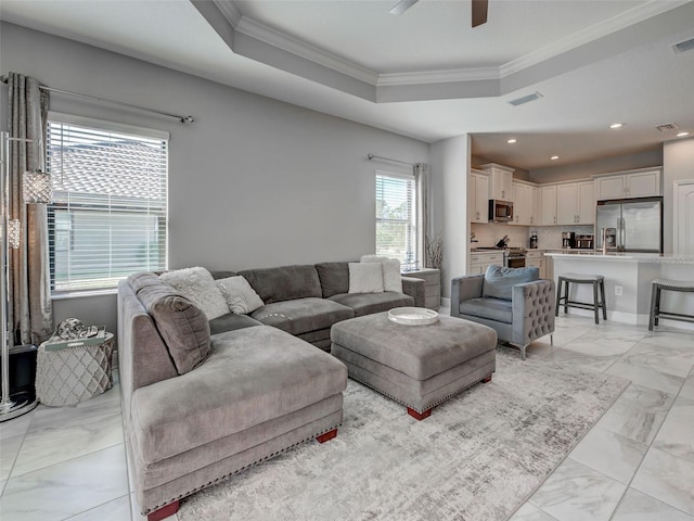 220 Sarezzo Cir, Nokomis, FL 34275 - living area featuring a raised ceiling, ornamental molding, ceiling fan, light marble finish flooring, and recessed lighting