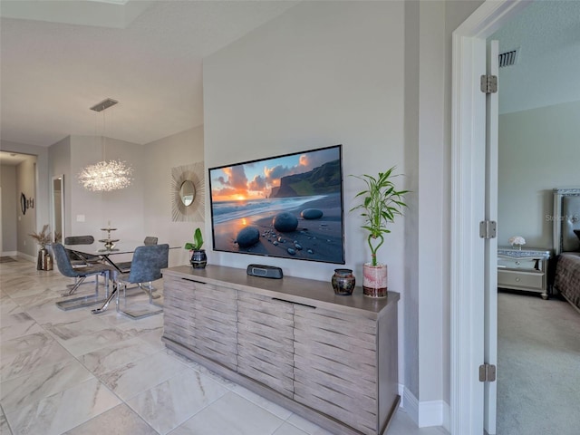 220 Sarezzo Cir, Nokomis, FL 34275 - living area featuring a chandelier and light marble finish flooring