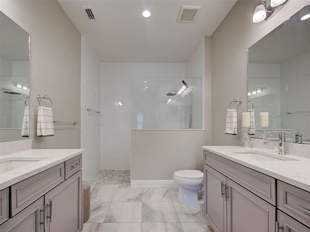 220 Sarezzo Cir, Nokomis, FL 34275 - bathroom with walk in shower, two vanities, toilet, and marble look tile flooring