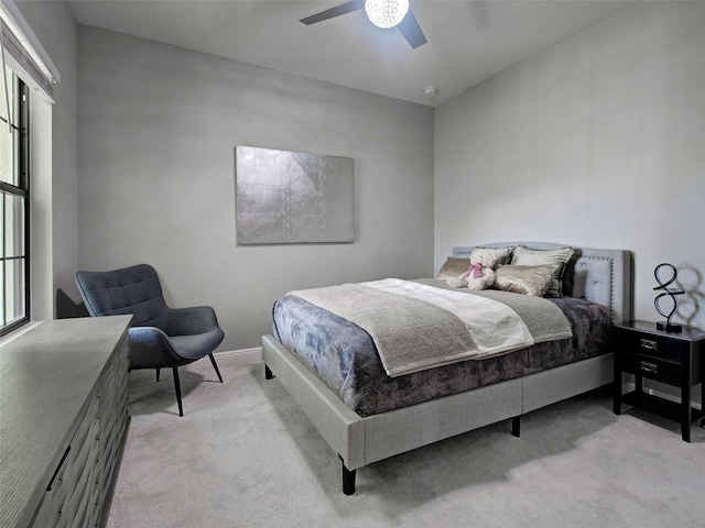 220 Sarezzo Cir, Nokomis, FL 34275 - bedroom featuring light carpet, ceiling fan, multiple windows, and baseboards