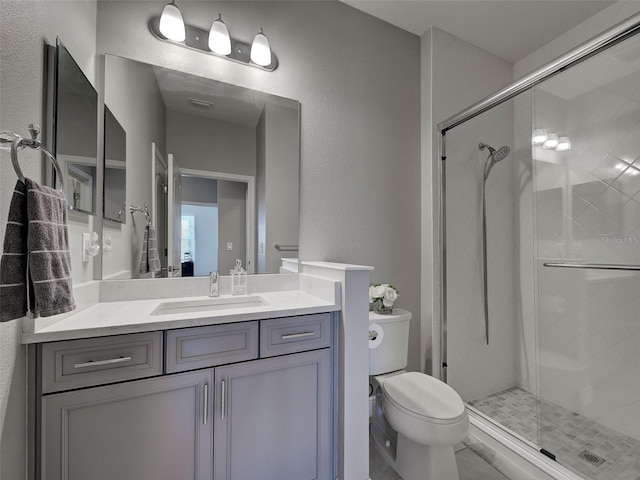 220 Sarezzo Cir, Nokomis, FL 34275 - full bath featuring a stall shower, toilet, vanity, and a textured wall