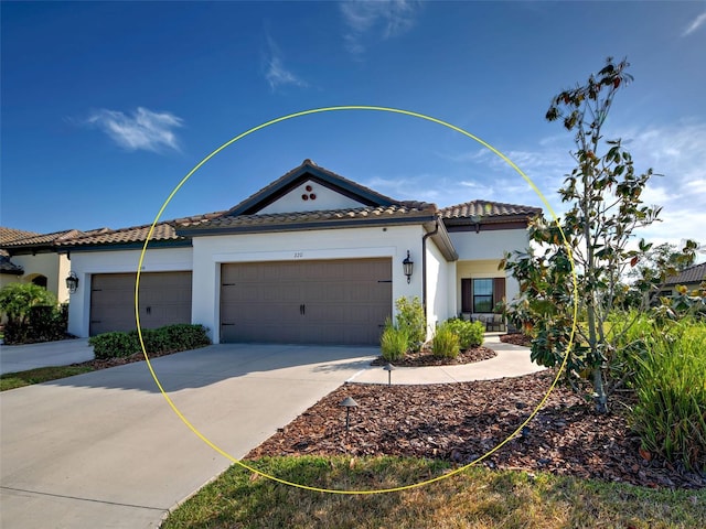 220 Sarezzo Cir, Nokomis, FL 34275 - view of front facade featuring an attached garage, stucco siding, a tiled roof, and concrete driveway