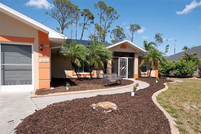 14124 Kewanee Ln, Port Charlotte, FL 33981 - single story home featuring an attached garage, driveway, and stucco siding
