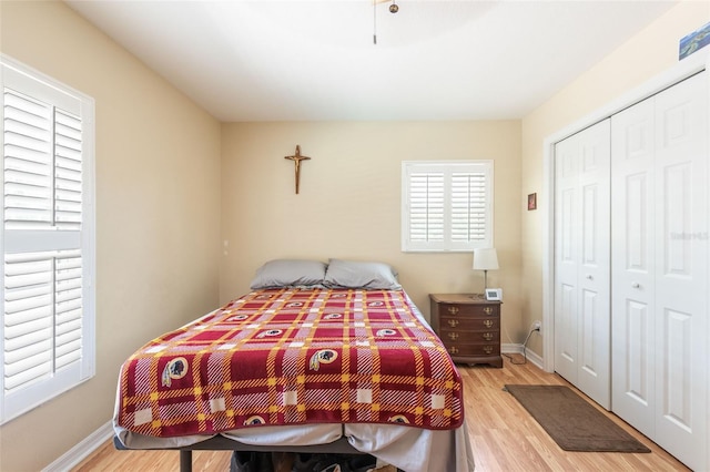 14124 Kewanee Ln, Port Charlotte, FL 33981 - bedroom featuring baseboards, light wood-style flooring, and a closet