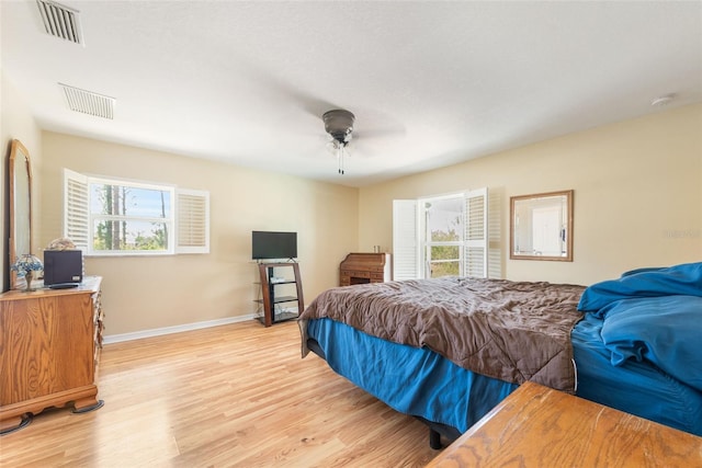 14124 Kewanee Ln, Port Charlotte, FL 33981 - bedroom featuring a ceiling fan, visible vents, light wood-style flooring, and baseboards