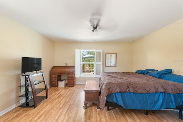 14124 Kewanee Ln, Port Charlotte, FL 33981 - bedroom with baseboards, a ceiling fan, and light wood finished floors