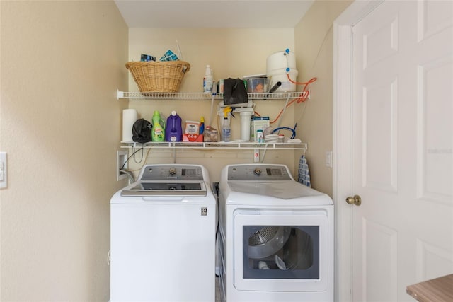 14124 Kewanee Ln, Port Charlotte, FL 33981 - clothes washing area featuring separate washer and dryer and laundry area