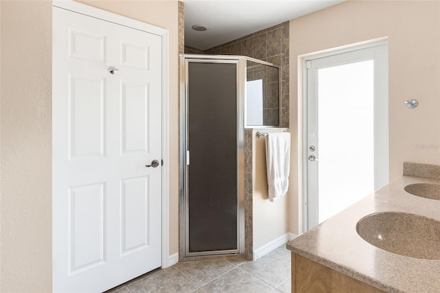 14124 Kewanee Ln, Port Charlotte, FL 33981 - full bath featuring baseboards, a stall shower, tile patterned flooring, and a sink