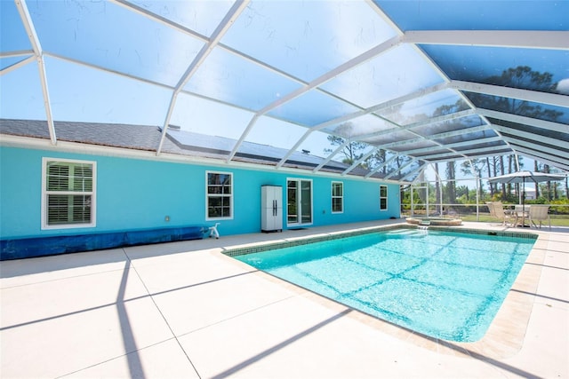 14124 Kewanee Ln, Port Charlotte, FL 33981 - view of swimming pool with a patio, glass enclosure, and a pool with connected hot tub