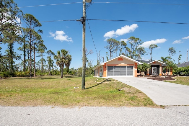 14124 Kewanee Ln, Port Charlotte, FL 33981 - ranch-style house with a front yard, a garage, and concrete driveway