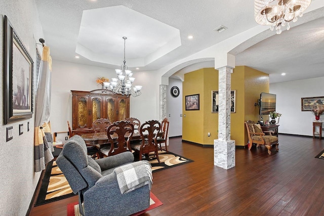 66 Statler St, Port Charlotte, FL 33954 - living room with arched walkways, a notable chandelier, ornate columns, and visible vents