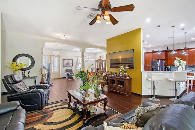 66 Statler St, Port Charlotte, FL 33954 - living room with visible vents, dark wood-style floors, recessed lighting, arched walkways, and ceiling fan with notable chandelier