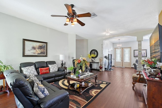 66 Statler St, Port Charlotte, FL 33954 - living room with dark wood-style flooring, arched walkways, ceiling fan, and decorative columns