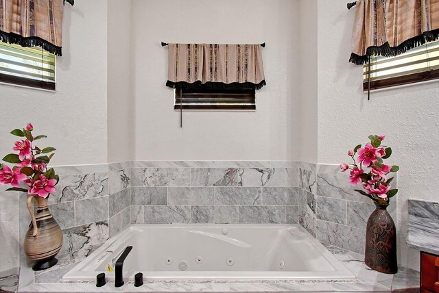 66 Statler St, Port Charlotte, FL 33954 - full bathroom featuring a tub with jets