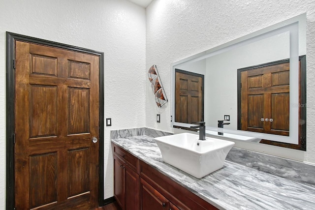 66 Statler St, Port Charlotte, FL 33954 - bathroom with vanity and a textured wall