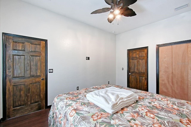 66 Statler St, Port Charlotte, FL 33954 - bedroom featuring multiple closets, ceiling fan, dark wood-style flooring, and visible vents