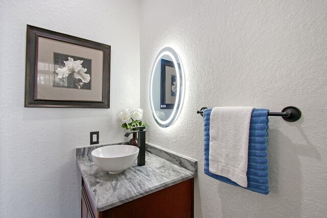 66 Statler St, Port Charlotte, FL 33954 - bathroom with a textured wall and vanity