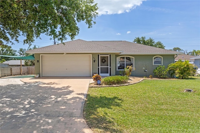 5264 Albion Rd, Venice, FL 34293 - single story home featuring concrete driveway, stucco siding, a front yard, an attached garage, and fence
