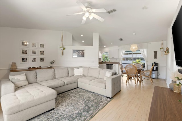 5264 Albion Rd, Venice, FL 34293 - living room with visible vents, a ceiling fan, light wood finished floors, and vaulted ceiling