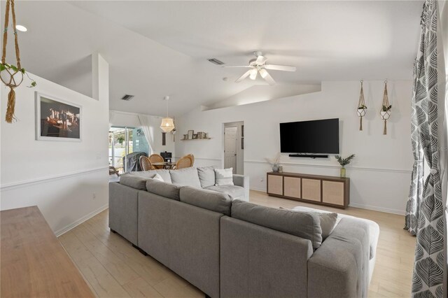 5264 Albion Rd, Venice, FL 34293 - living room with a ceiling fan, visible vents, lofted ceiling, and light wood-style floors