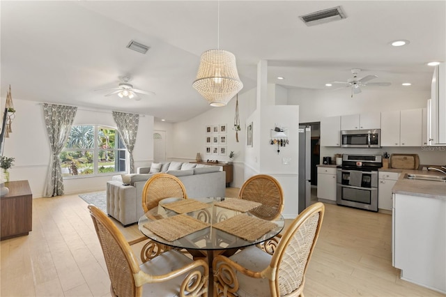 5264 Albion Rd, Venice, FL 34293 - dining space with visible vents, light wood-style flooring, ceiling fan, and lofted ceiling