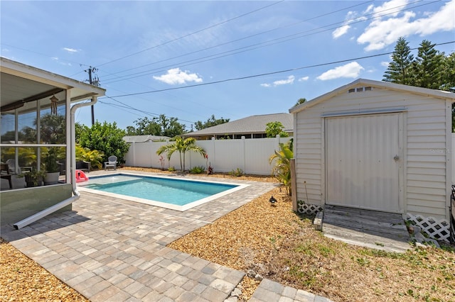 5264 Albion Rd, Venice, FL 34293 - view of swimming pool featuring a patio, a fenced in pool, a shed, an outbuilding, and a fenced backyard