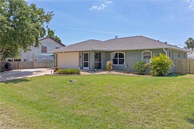 5264 Albion Rd, Venice, FL 34293 - single story home featuring a garage, fence, stucco siding, and a front yard