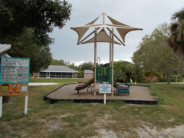 5264 Albion Rd, Venice, FL 34293 - community playground featuring a lawn