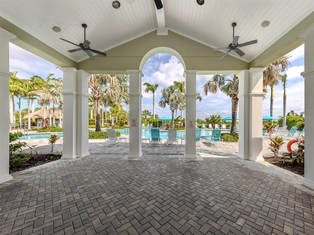 view of patio / terrace with a ceiling fan and a community pool