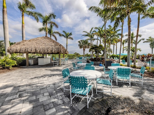 view of patio featuring a gazebo and outdoor dining space