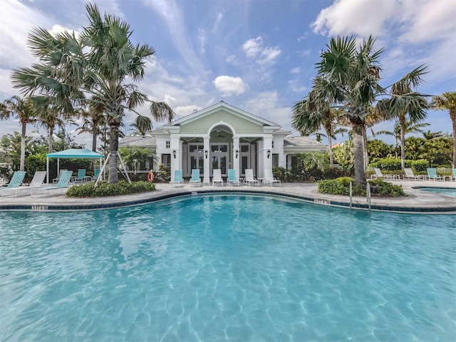 community pool featuring a patio area