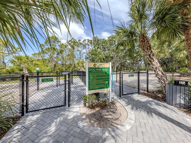 view of gate featuring fence