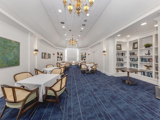 carpeted dining space with a chandelier, visible vents, and recessed lighting