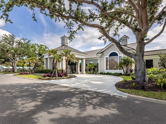 view of property with curved driveway