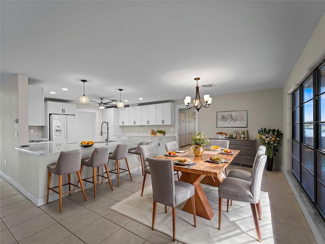 dining room featuring an inviting chandelier, light tile patterned floors, visible vents, and recessed lighting