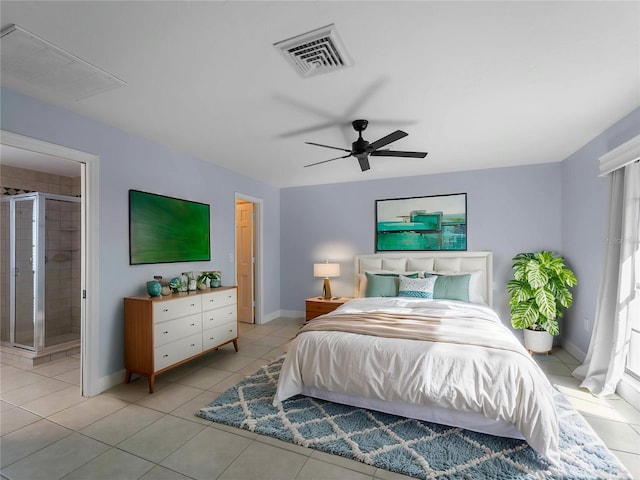 bedroom featuring light tile patterned floors, visible vents, and baseboards