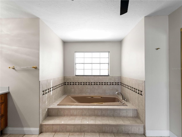 bathroom featuring a bath and vanity