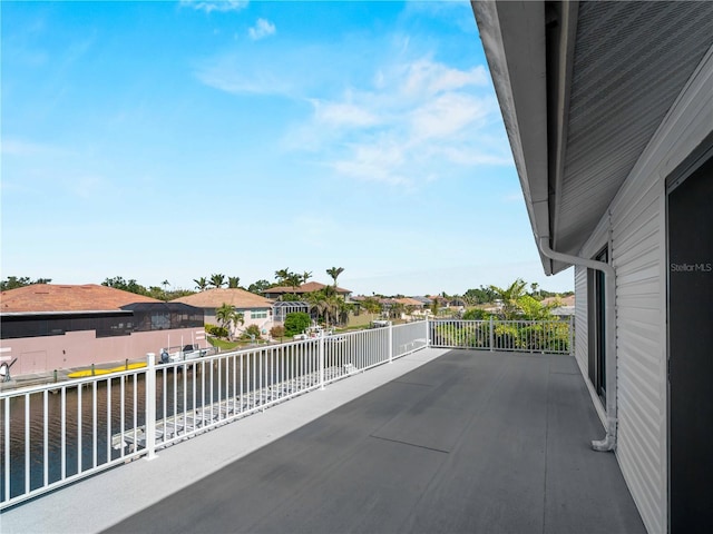 balcony with a water view and a residential view