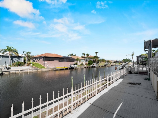 water view with fence and a residential view