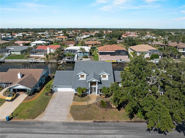 aerial view featuring a residential view and a water view