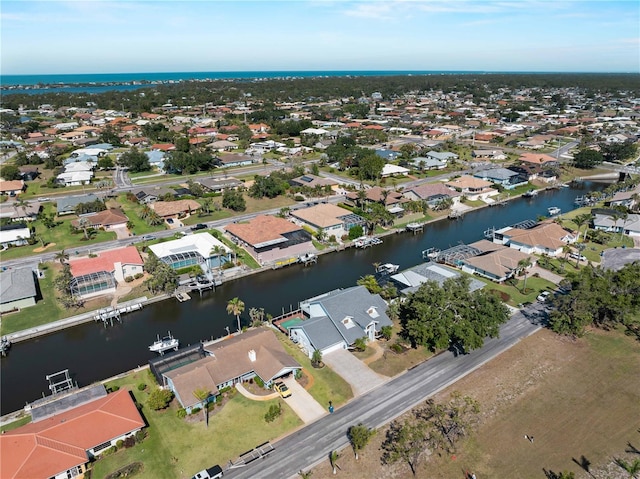 aerial view featuring a residential view and a water view